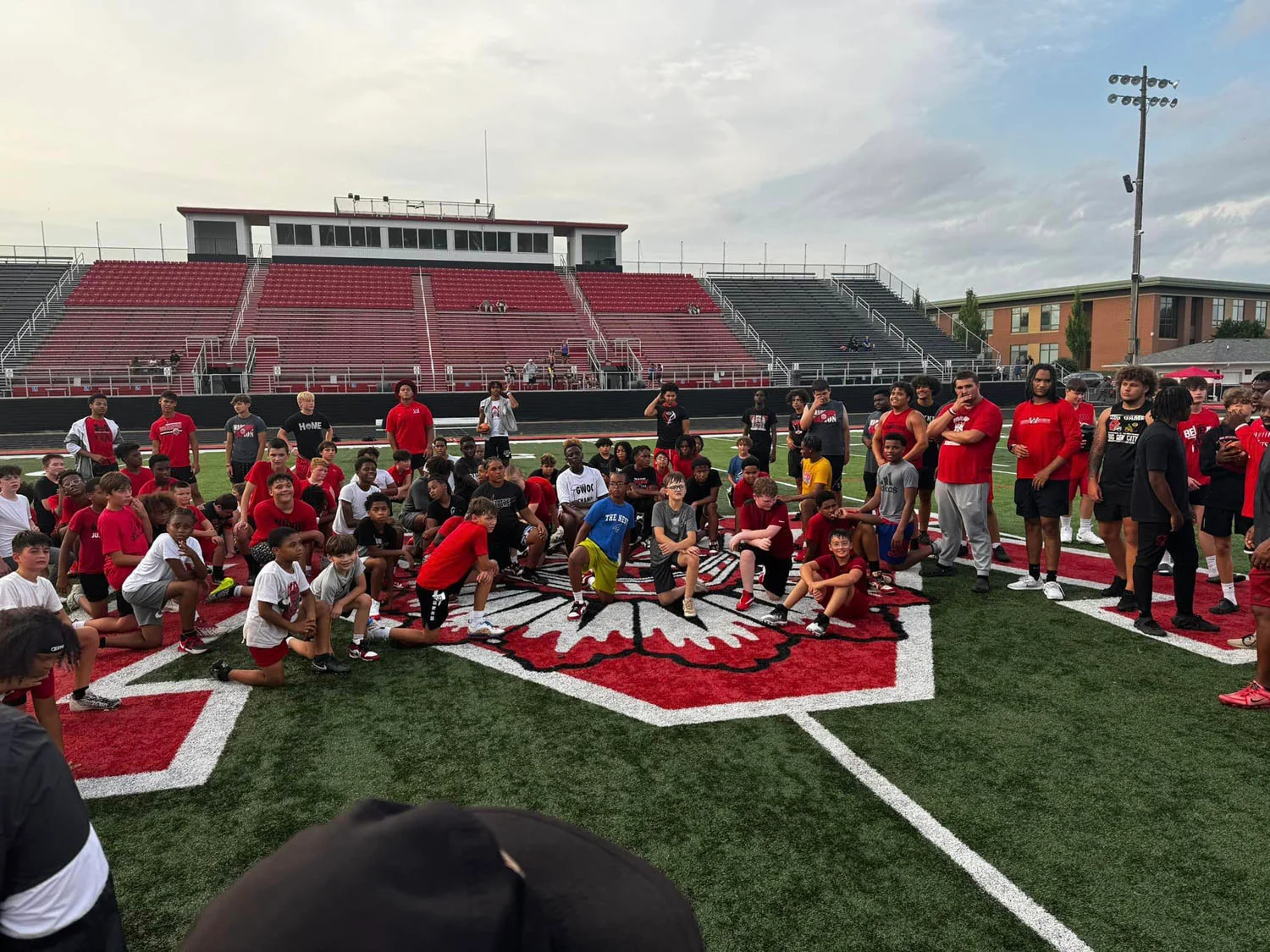 Campers listening to coach at camp